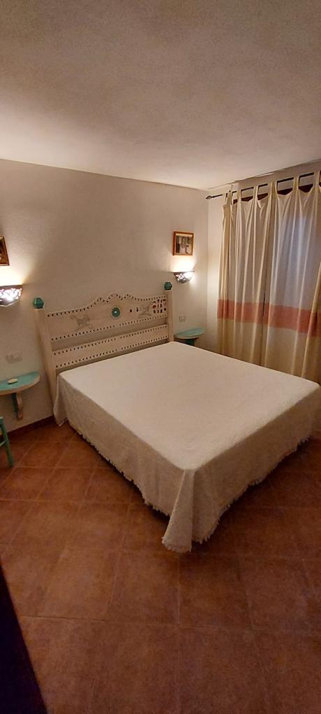 Camera da letto arredata dell’appartamento Corbezzolo
